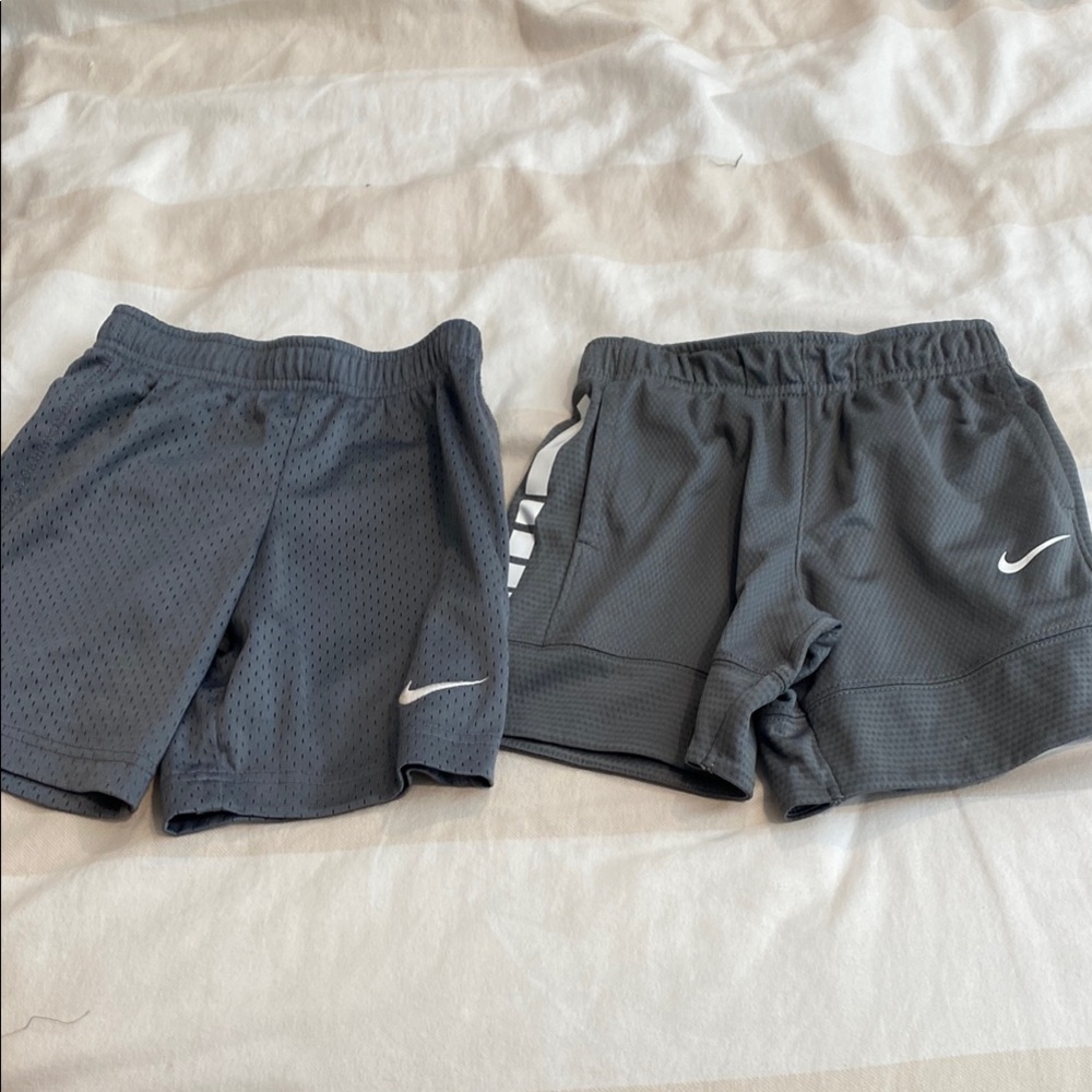 2 pairs of gray Nike shorts